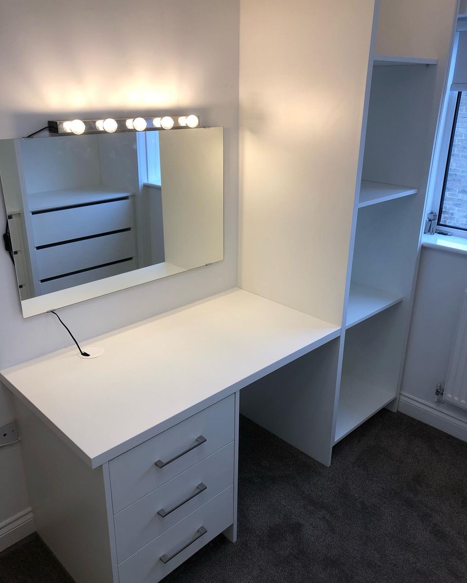Walk-in wardrobe with dressing table, mirror and shelving